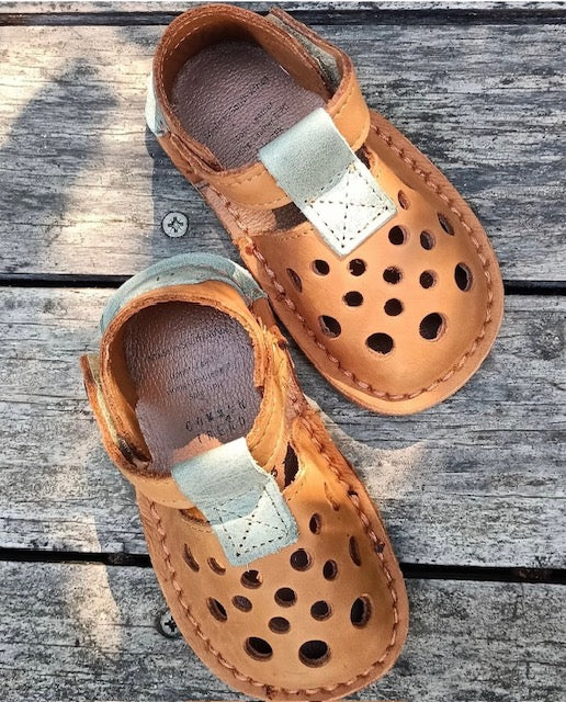 Barefoot sandals for kids with flexible soles and wide toe boxes designed for healthy foot development