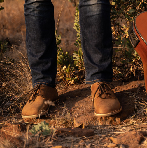 Man wearing Common Tread Traversa men’s barefoot leather shoes outdoors in natural light