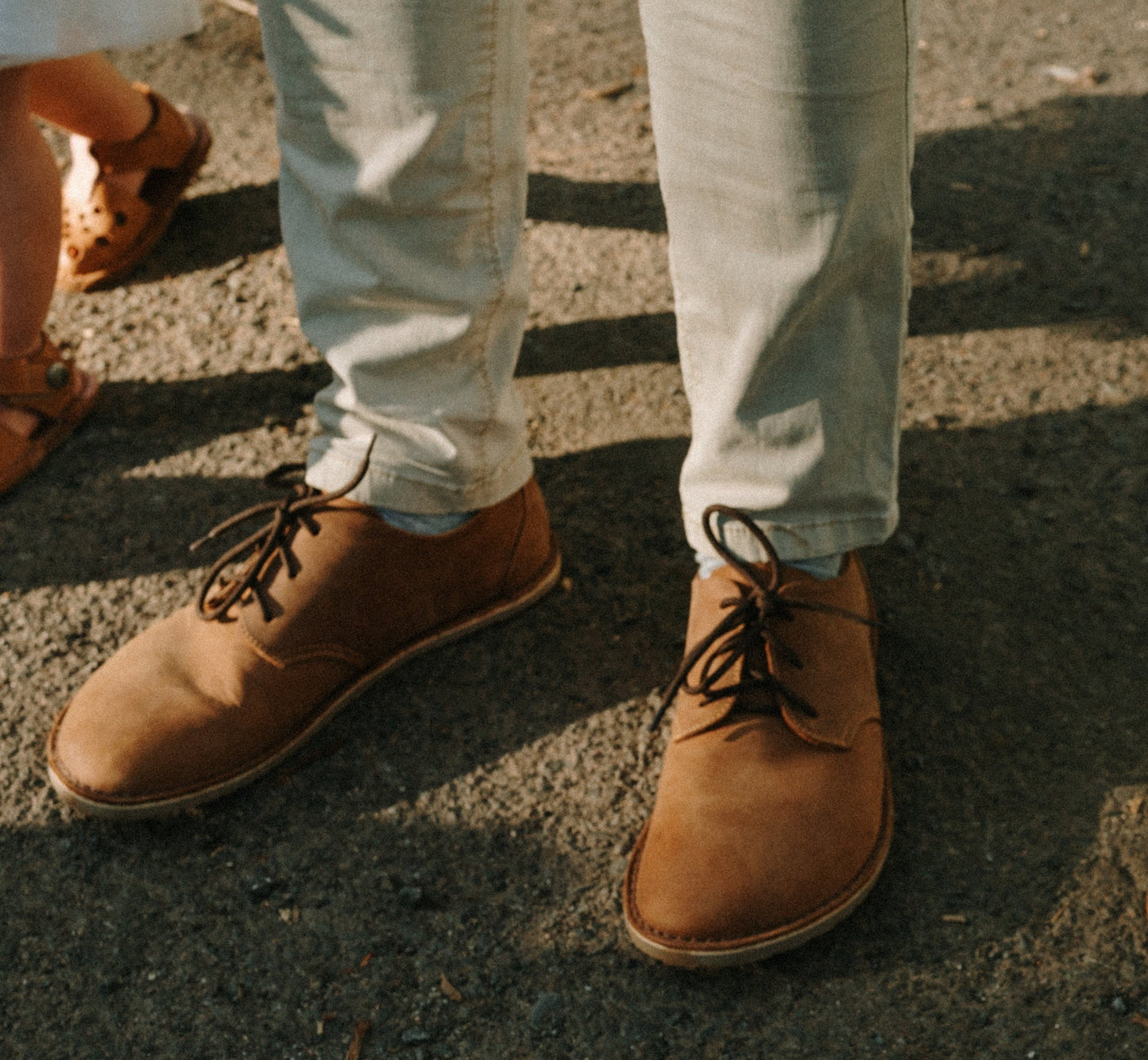 Man walking in Common Tread Traversa men’s barefoot leather shoes outdoors