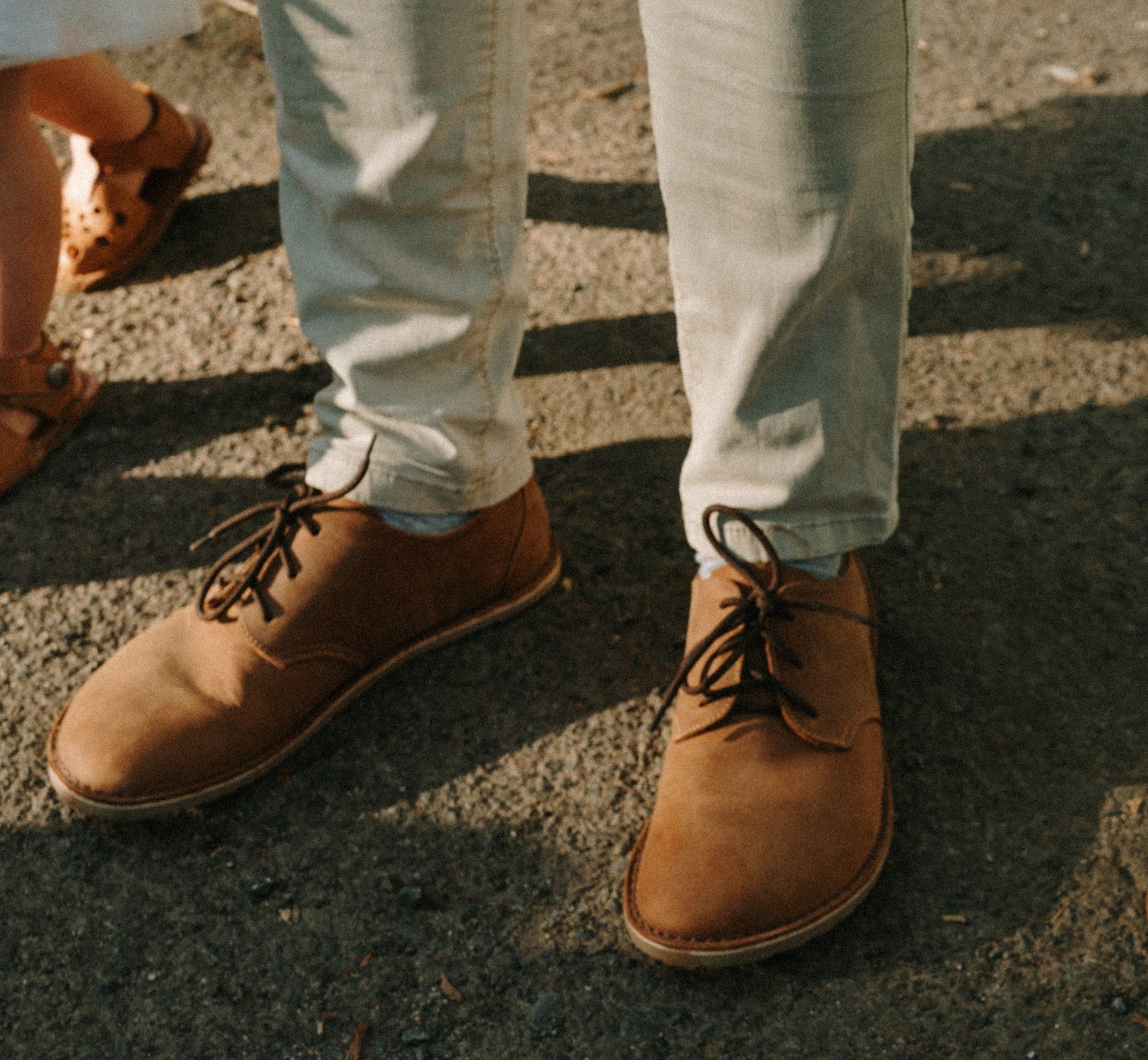 Man walking in Common Tread Traversa men’s barefoot leather shoes outdoors