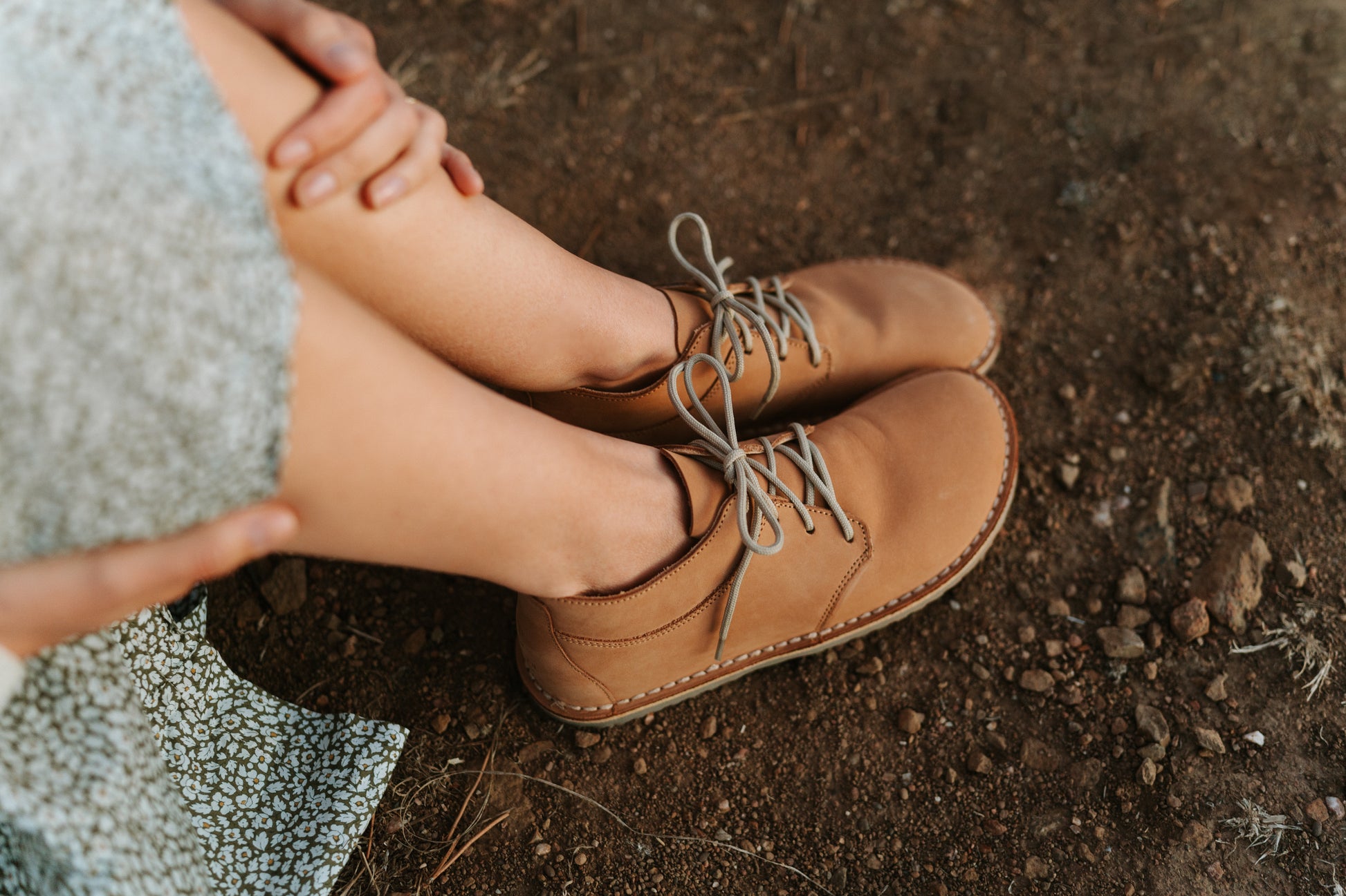 Close-up top view of Common Tread Tundra women’s barefoot leather shoes outdoors