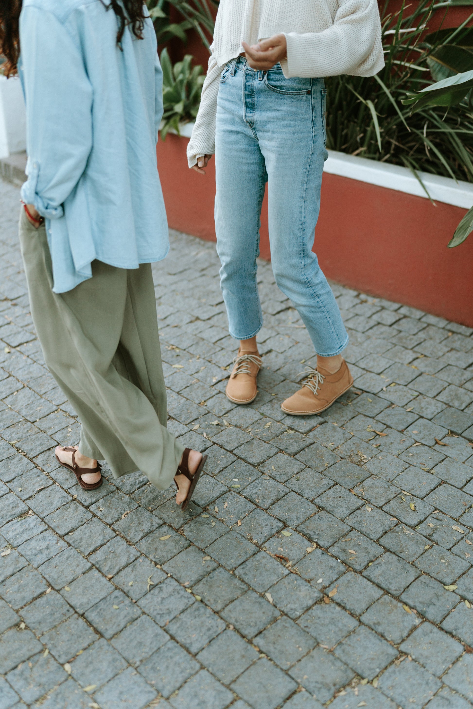 Women walking in Common Tread Tundra barefoot leather shoes in an everyday lifestyle setting