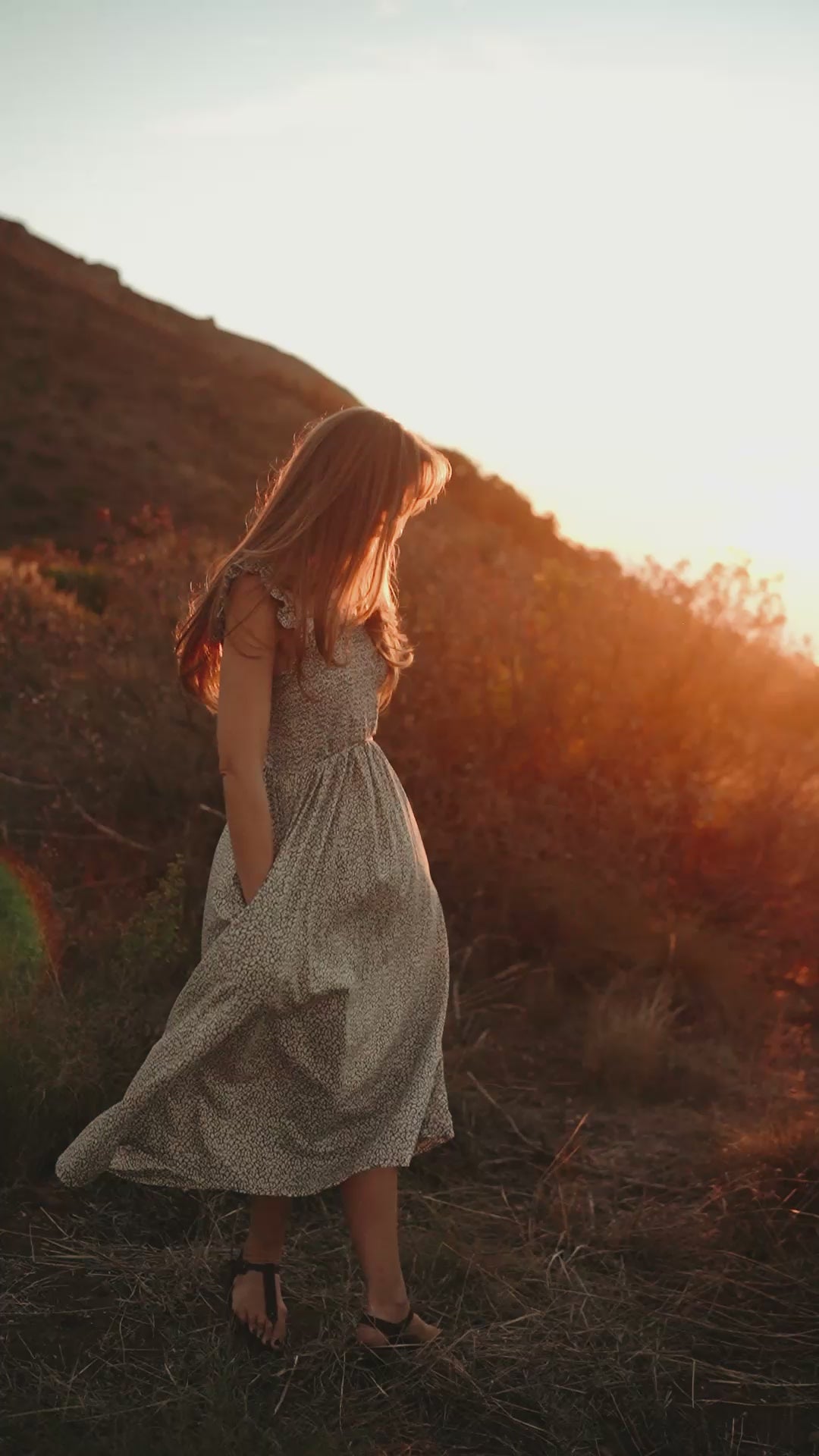 Woman walking in Sierra women’s leather barefoot sandals in natural sunlight