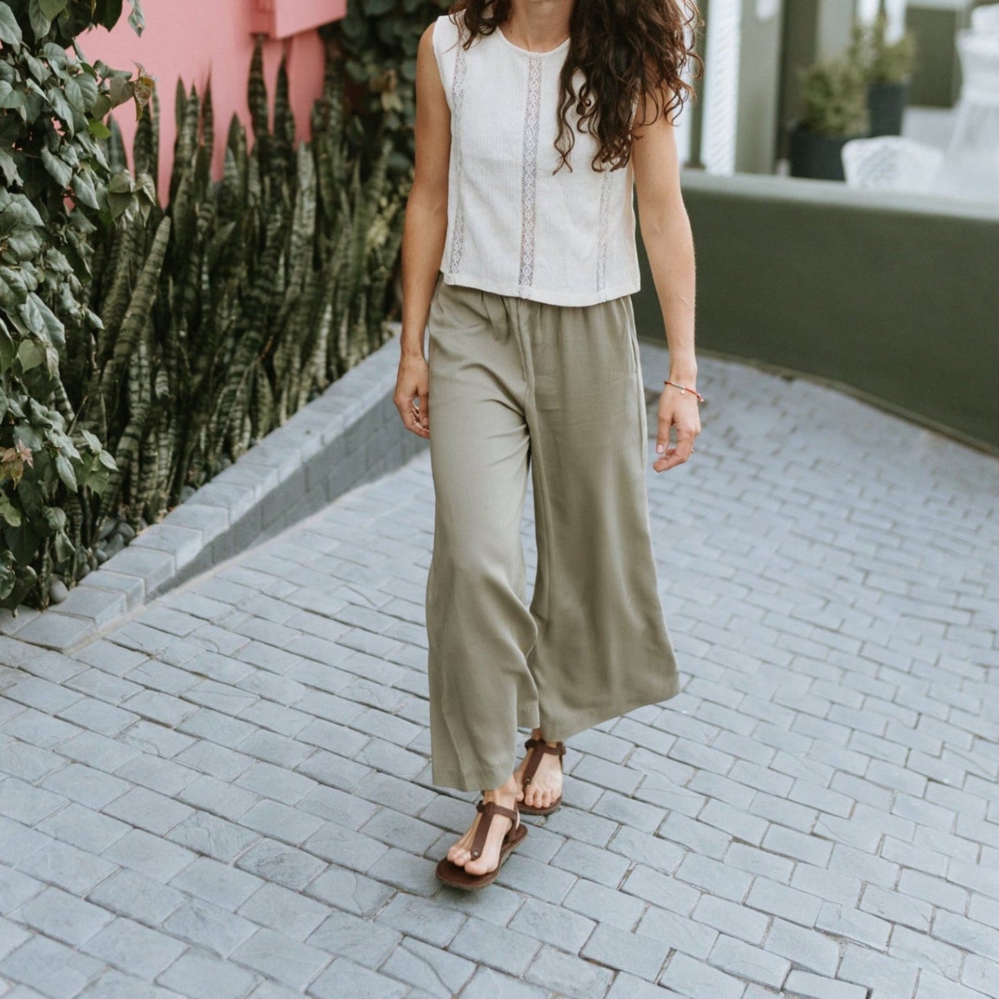 Woman walking outdoors wearing Sierra women’s leather barefoot sandals